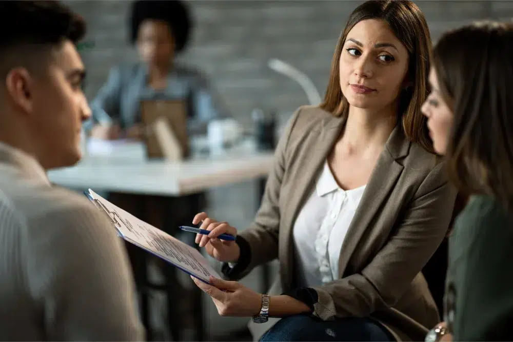 Professional woman deciding between job offers- asking employers what is group health insurance at these companies professional woman deciding between job offers asking employers what is group health insurance at these companies