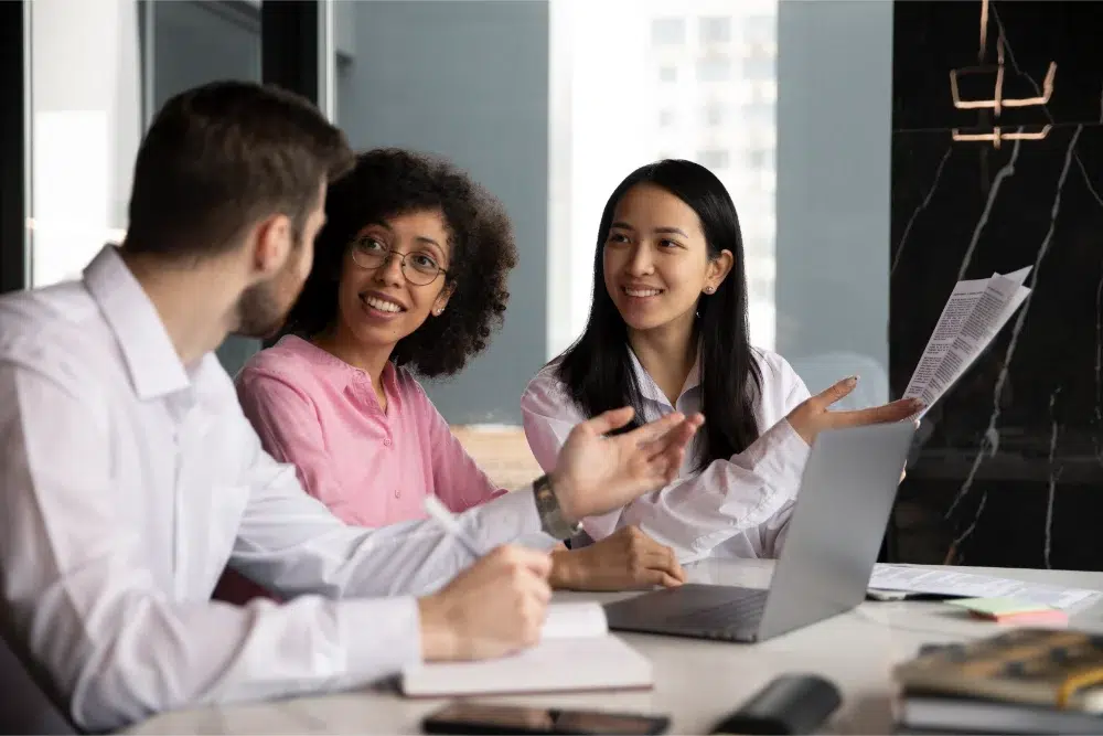 Employees discussing health spending account at workplace office employees discussing health spending account at workplace office