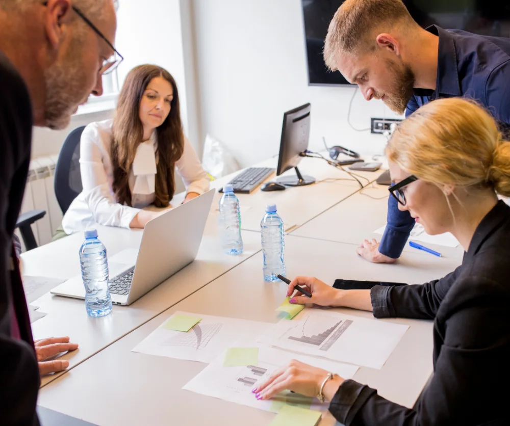 group businesspeople analyzing different type graph table office group registered retirement savings plan