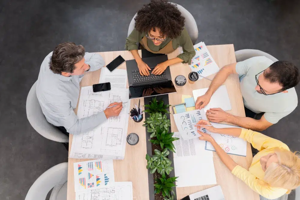 aerialview hr young business team meeting at desk discussing deferred profit sharing plan deferred profit sharing plan